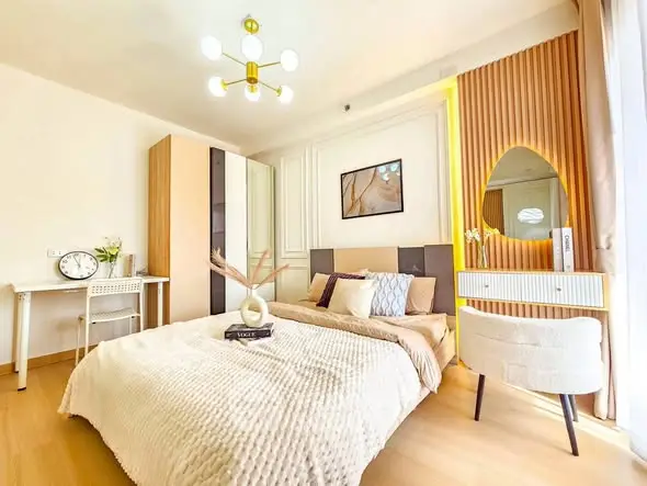 Luxurious bedroom with modern decor, elegant lighting, and stylish furniture, perfect for a serene retreat.