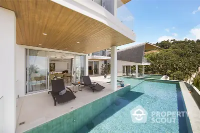 Luxurious modern villa with infinity pool and stunning tropical views.