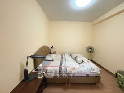 Cozy bedroom with modern furnishings and soft lighting, perfect for relaxation.