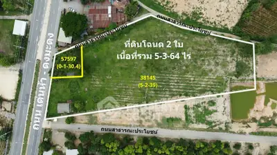 Aerial view of a large plot of land for sale with road access and clear boundaries.