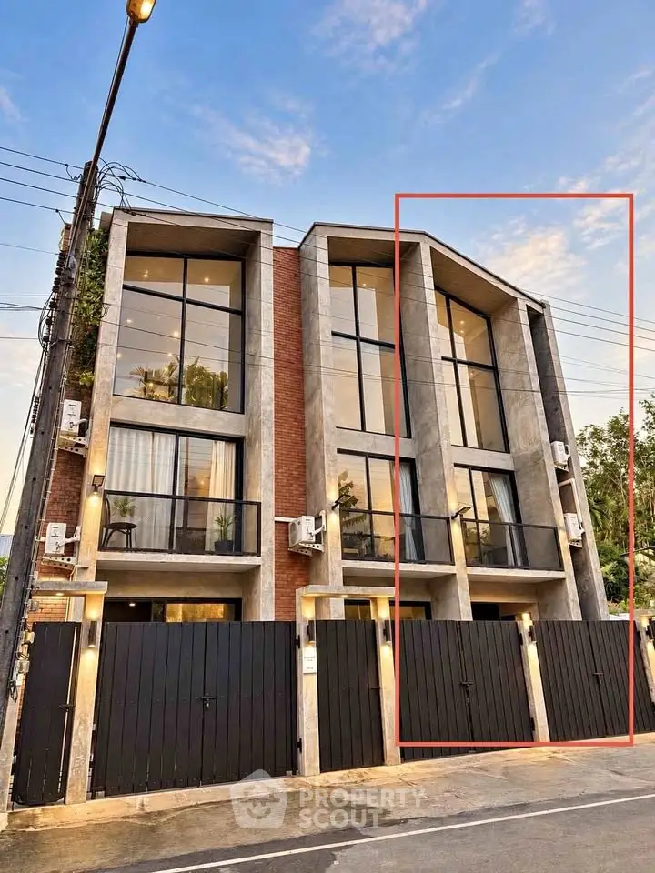 Modern multi-story building with sleek design and large windows, perfect for urban living.