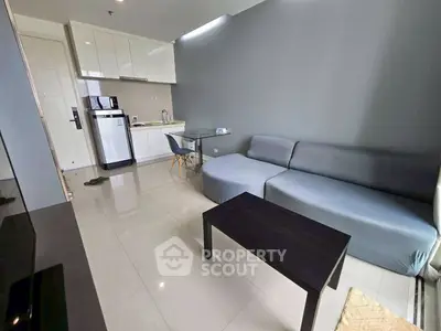 Modern living room with sleek kitchen and stylish furniture in open layout