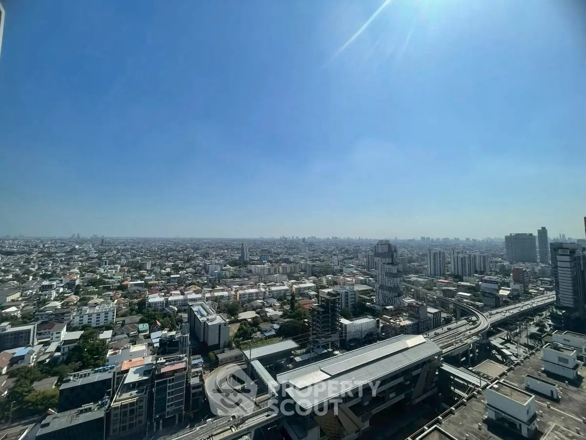 Stunning panoramic cityscape view from high-rise building, showcasing urban skyline and vibrant city life.