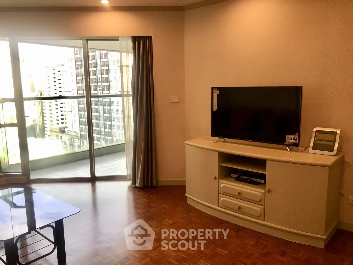 Spacious living room with balcony view in modern apartment