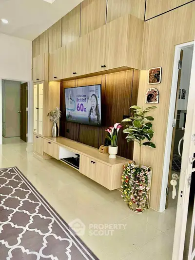Modern living room with stylish wooden TV unit and elegant decor