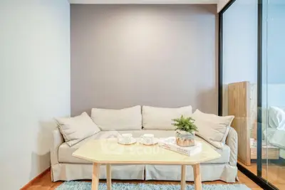 Cozy living room with beige sofa and modern decor