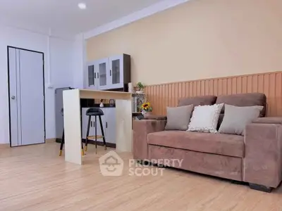 Modern living room with cozy brown sofa and stylish bar counter