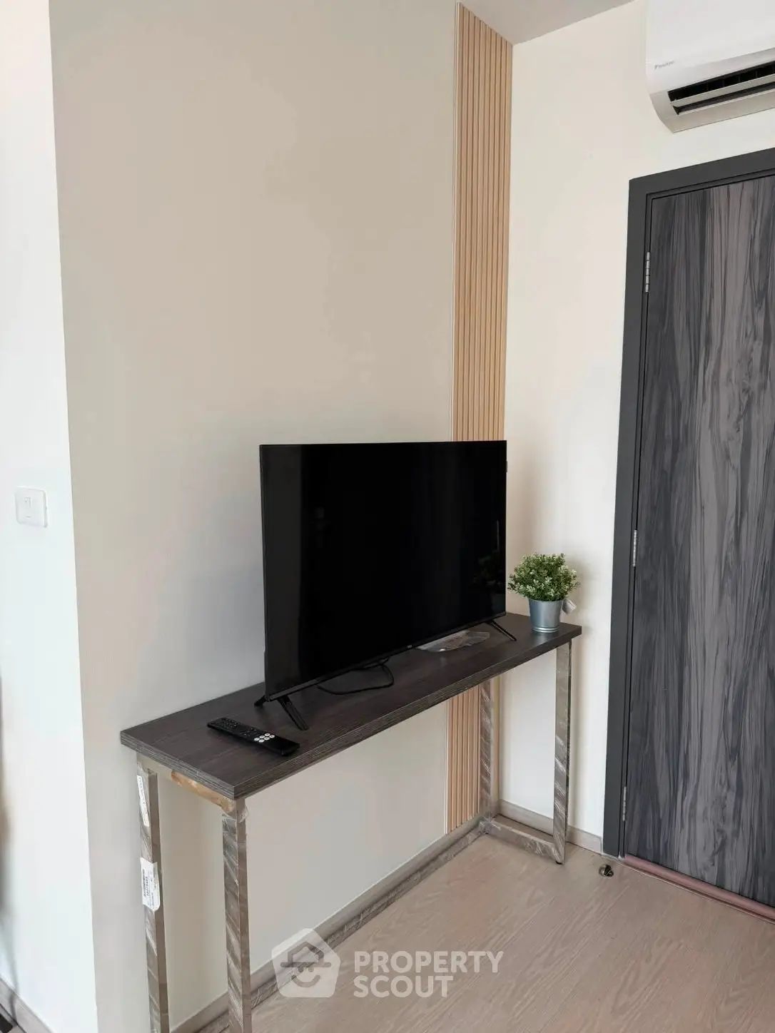 Modern living room corner with sleek TV setup and stylish decor