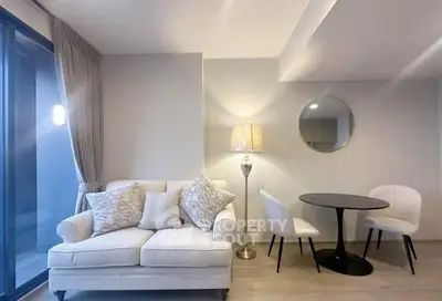 Modern living room with elegant sofa, stylish lamp, and chic dining set in a cozy apartment.
