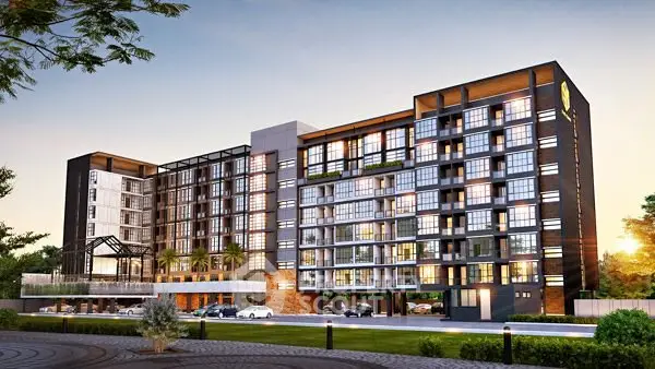 Modern apartment building exterior with sleek design and lush surroundings at sunset.