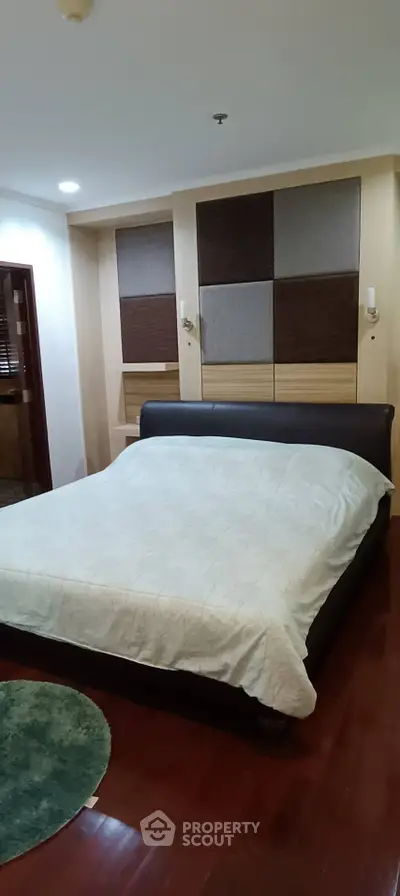 Cozy bedroom with modern decor and wooden flooring