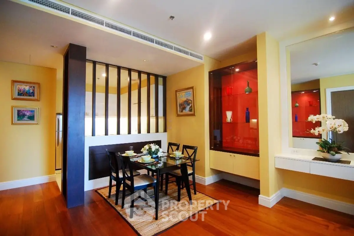 Charming dining area with elegant decor and warm lighting in a modern apartment.