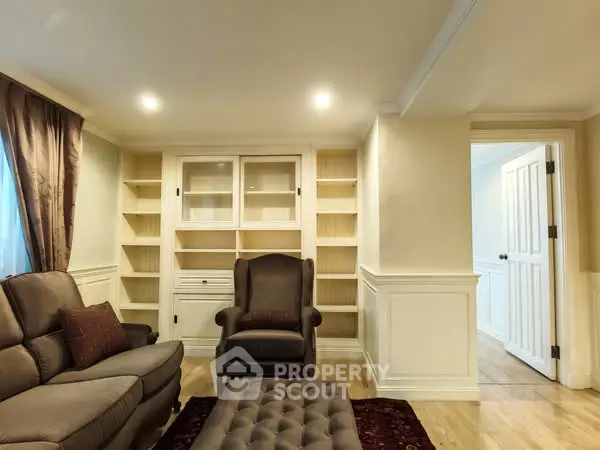 Elegant living room with built-in shelves and cozy seating area