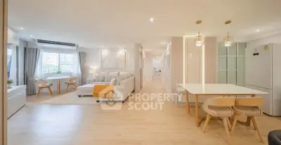 Spacious modern living room with dining area and natural light
