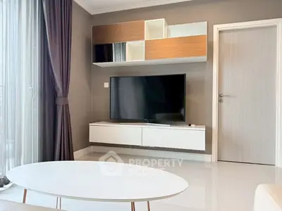 Modern living room with sleek TV setup and stylish furniture