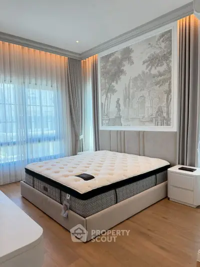 Luxurious bedroom with elegant decor and large window, featuring a plush bed and stylish nightstands.