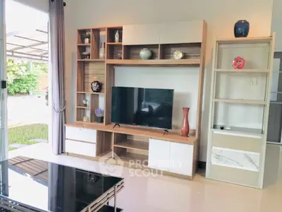 Modern living room with stylish entertainment center and garden view