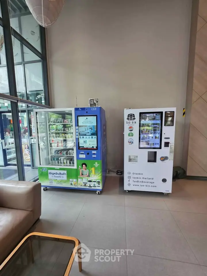 Modern lobby with vending machines and stylish seating area