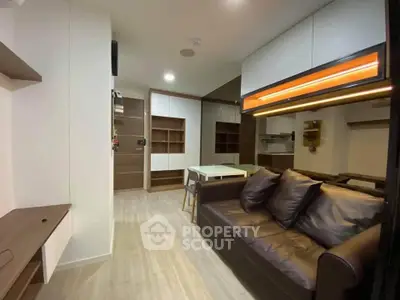 Modern living room with sleek furniture and built-in storage solutions