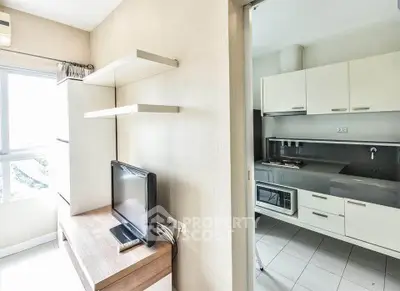 Modern apartment with sleek kitchen and cozy living area