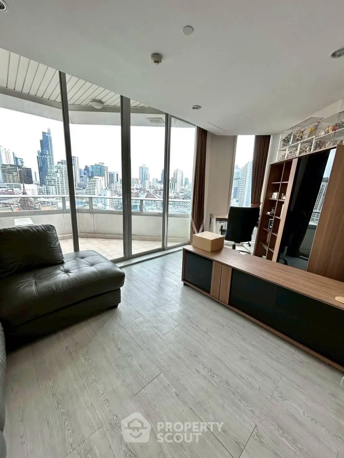 Spacious living room with stunning city view and large balcony access