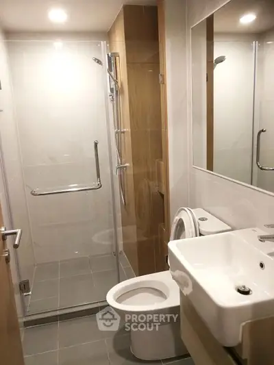 Modern bathroom with glass shower and sleek fixtures