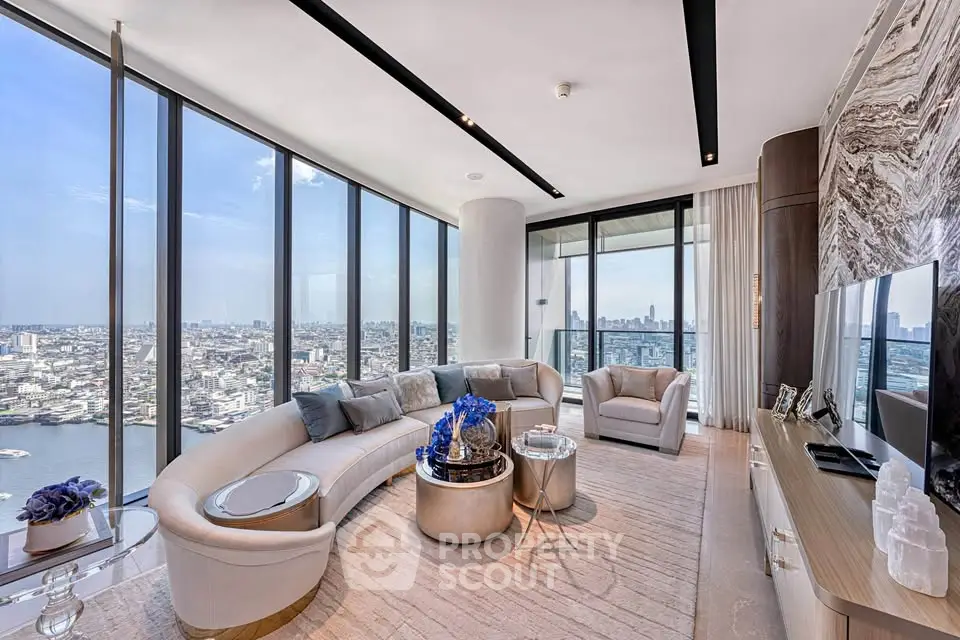 Luxurious high-rise living room with panoramic city views and elegant modern furnishings.