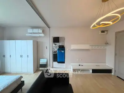 Modern studio apartment with sleek design and stylish lighting