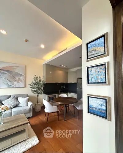 Modern open-layout living room with cozy seating and stylish kitchen area, perfect for urban living.