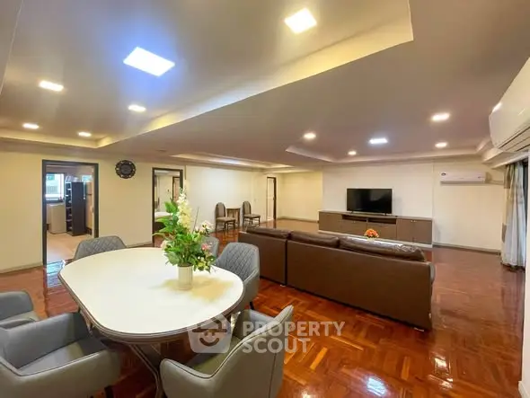 Spacious living room with elegant dining area and modern decor