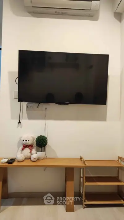 Cozy living room with wall-mounted TV and stylish decor