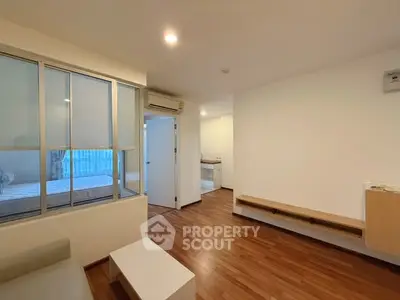 Modern apartment with wooden flooring and minimalist design