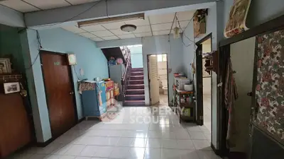 Charming vintage interior with staircase and eclectic decor