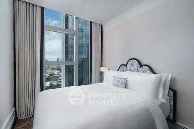 Luxurious bedroom with stunning city view and elegant decor