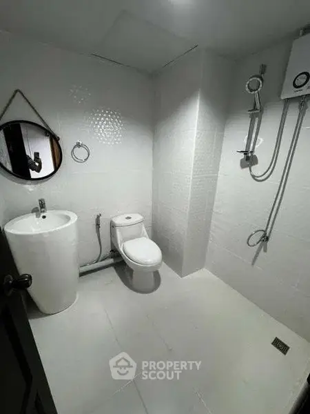 Modern minimalist bathroom with sleek fixtures and white tiles