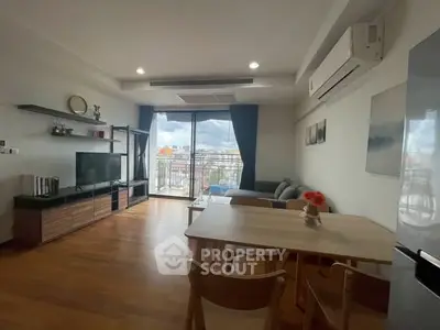 Modern living room with balcony view and stylish furniture