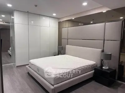 Modern bedroom with sleek design and ample storage space