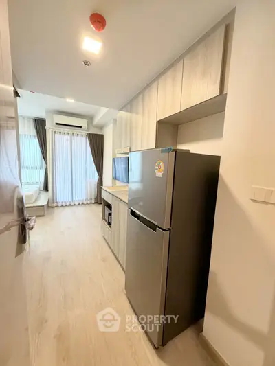 Modern kitchen with sleek appliances and open layout in a stylish apartment