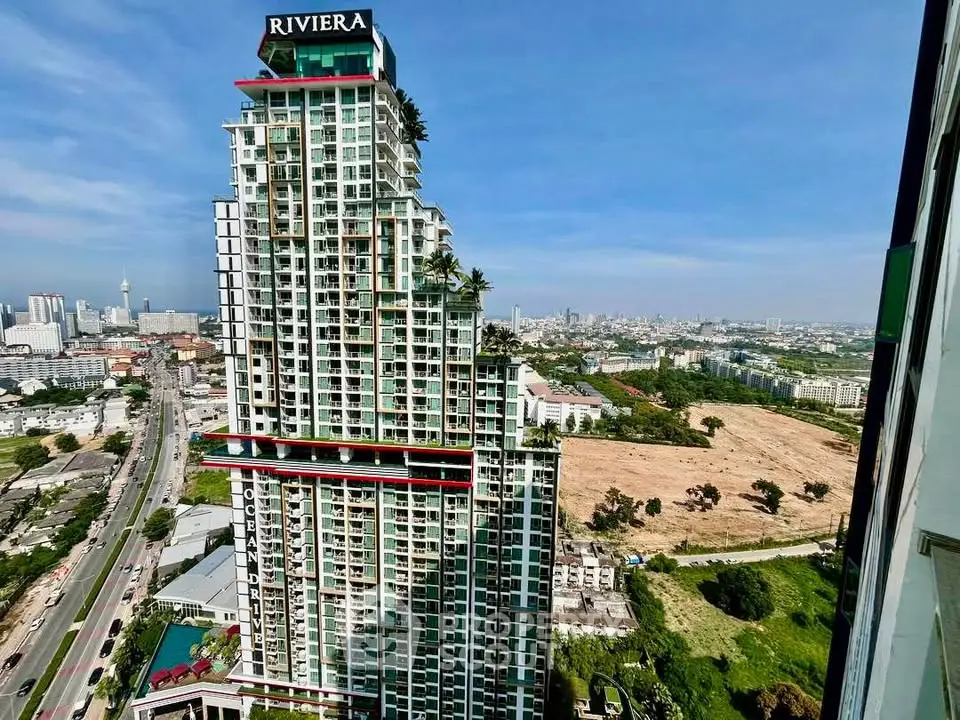 Stunning high-rise building with panoramic city views and lush greenery