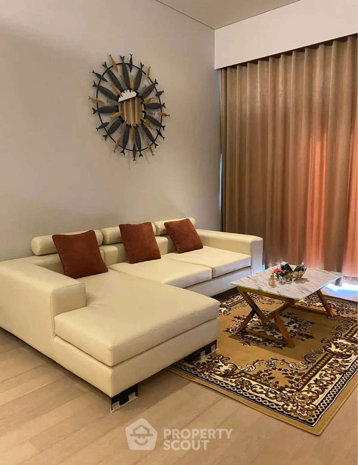 Elegant living room with modern white sectional sofa and decorative wall art