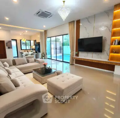 Luxurious modern living room with elegant decor and pool view