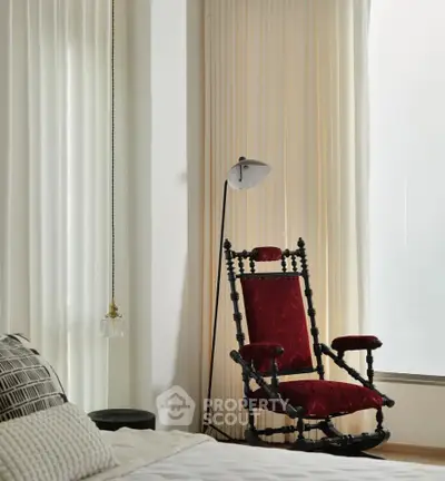 Elegant bedroom corner with vintage red armchair and modern floor lamp