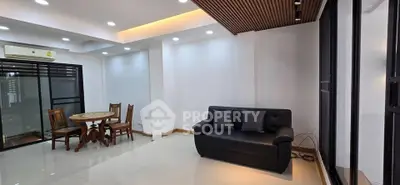 Spacious modern living room with sleek design and ample natural light