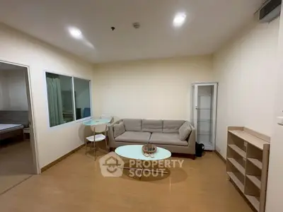 Spacious living room with modern furniture and wooden flooring