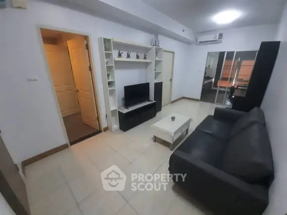 Cozy living room with modern furniture and TV setup