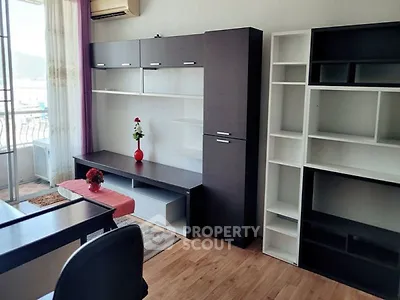 Modern living room with stylish shelving and balcony view