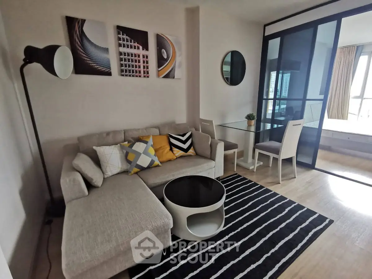 Modern living room with stylish decor and cozy seating area in a contemporary apartment.