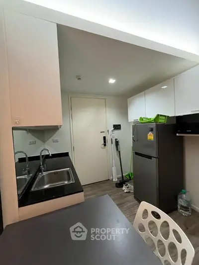 Modern kitchen with sleek cabinets and stainless steel appliances