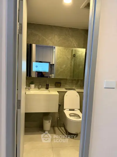 Modern bathroom with sleek design and elegant fixtures in a contemporary apartment.