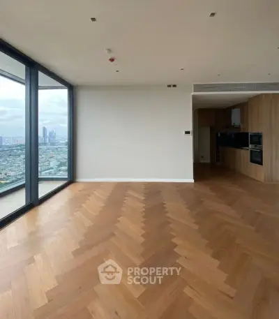 Spacious modern living room with city view and open kitchen layout